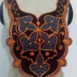 A brown and yellow embroidery